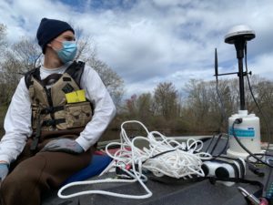 Employee wearing PPE while working in the field