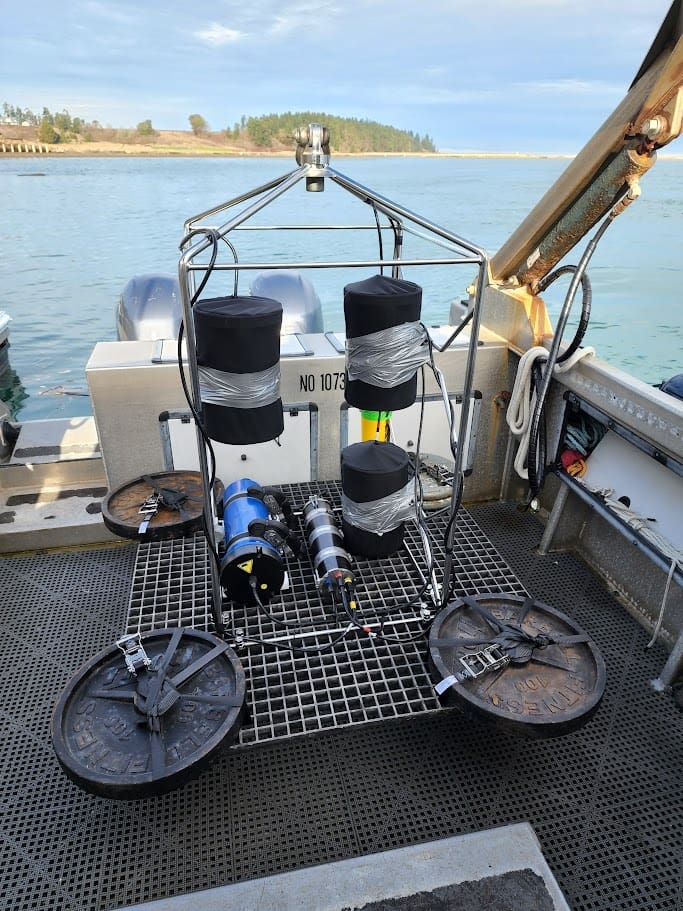 NoiseSpotter acoustic monitoring frame with hydrophones mounted on vessel deck ready for deployment.